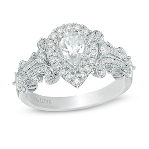 May include: A white gold ring featuring a pear-shaped center stone surrounded by a halo of smaller stones. The band and shoulders are adorned with intricate, sparkling details. The words "FOREVER LOVE" are engraved on the band.