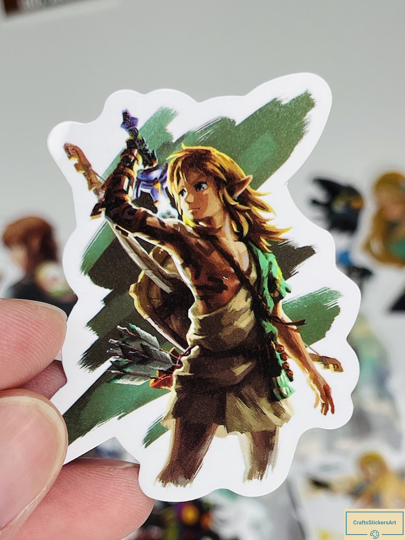 May include: A sticker featuring a cartoon illustration of Link from the Legend of Zelda video game series. Link is depicted in a green tunic and brown trousers, holding a sword and a bow and arrow. The background is a green and white abstract design.