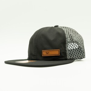 Side view of olive Richardson 935 performance hat with light gray mesh back and leather Active Mountain patch, water resistant leather patch mountain hat ready for trail or campsite