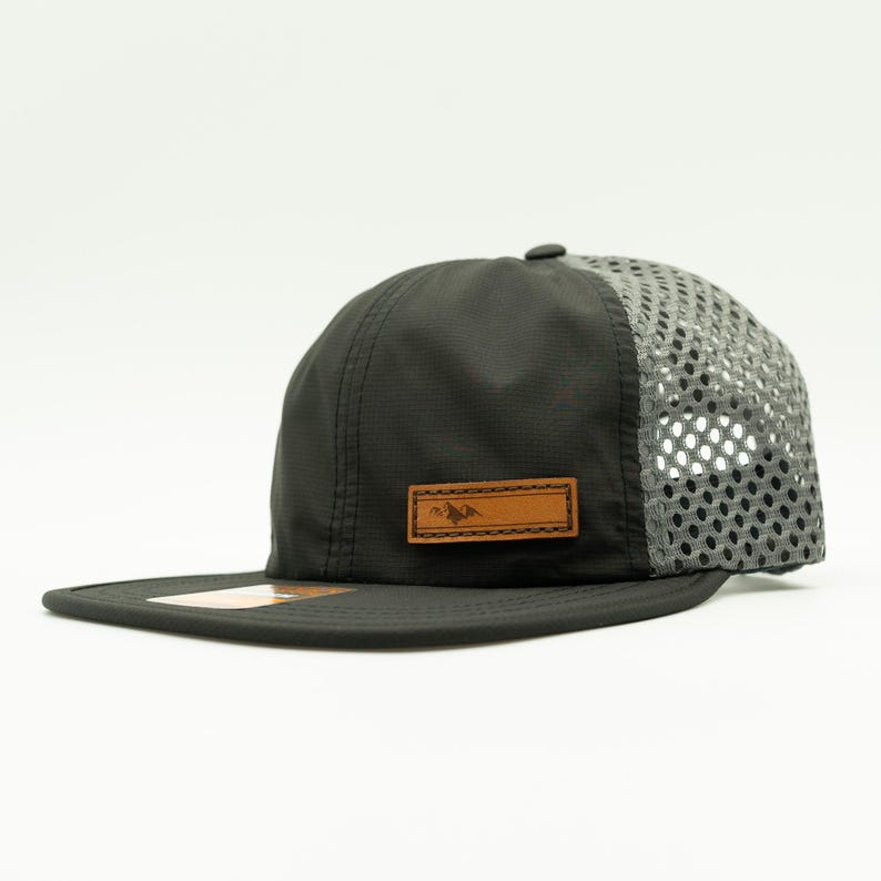 Side view of olive Richardson 935 performance hat with light gray mesh back and leather Active Mountain patch, water resistant leather patch mountain hat ready for trail or campsite