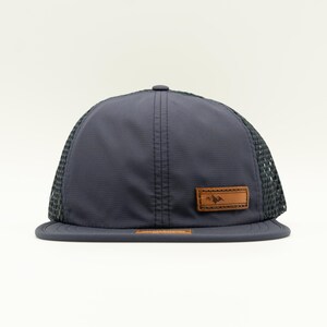 Front view of navy Richardson 935 water resistant performance hat with full grain leather Active Mountain patch, mesh back and quick-adjust strap, everyday outdoors hat