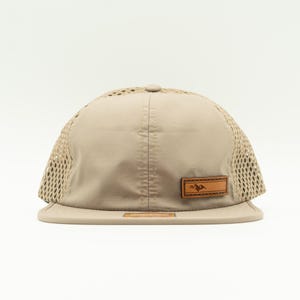 Front view of sand Richardson 935 performance outdoors hat with real leather Active Mountain patch, curved bill and breathable mesh, water resistant leather patch hat for hiking and travel