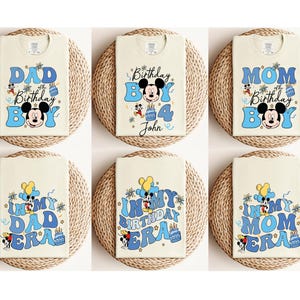 May include: Six white t-shirts with blue and yellow Mickey Mouse birthday designs. The shirts feature the text "Dad", "Mom", "In My Birthday Era", and "4th Birthday Boy John".
