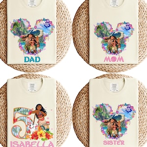 May include: Four cream-colored t-shirts with Disney-themed graphics. One shirt says "DAD", another says "MOM", a third says "SISTER", and the last says "ISABELLA" with a number 5. Each shirt has a Mickey Mouse head shape with a colorful floral design.