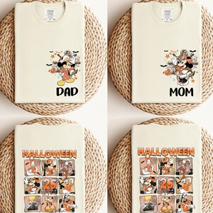K&ouml;nnte beinhalten: Vier cremefarbene T-Shirts mit Halloween-Motiven. Zwei Shirts zeigen Micky Maus mit den Worten "DAD" und "MOM". Die anderen beiden Shirts haben ein Rasterdesign mit verschiedenen Disney-Figuren und dem Text "HALLOWEEN 25 HIGH SEAS".