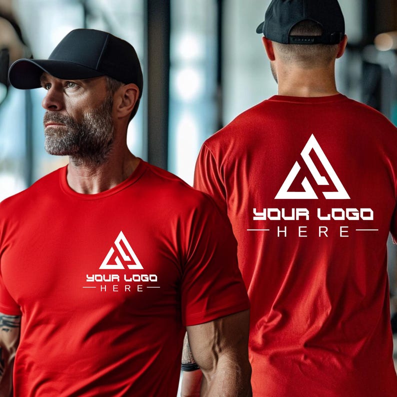 May include: Two red t-shirts with a white triangle logo and the text "YOUR LOGO HERE" printed on the front and back.