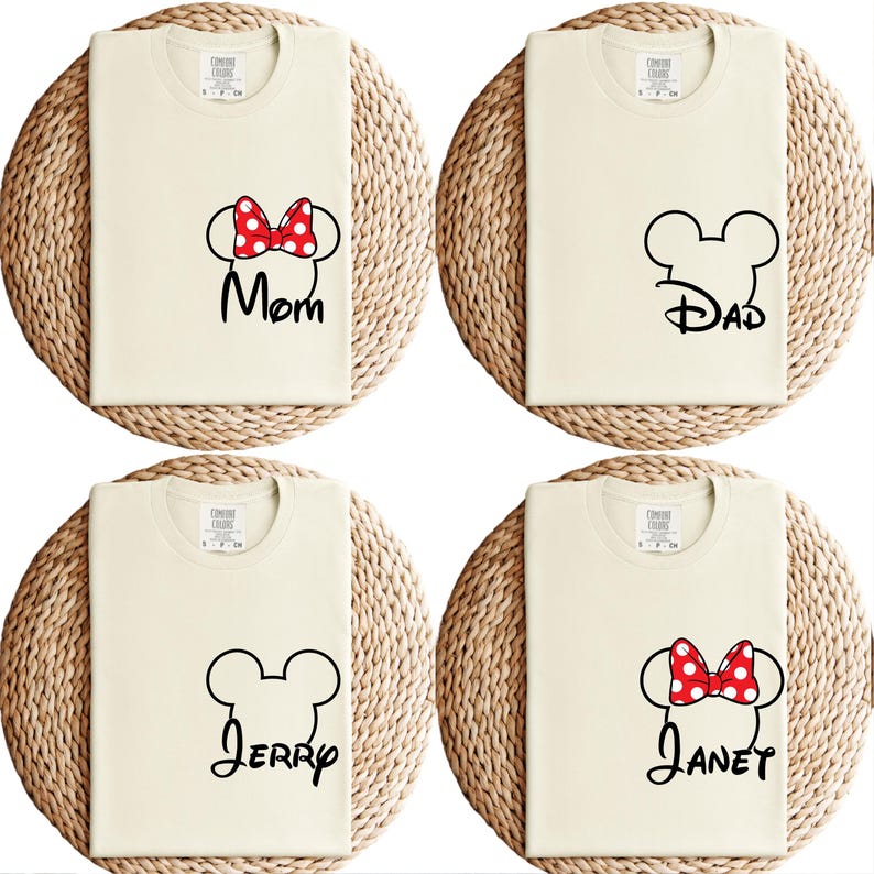 May include: Four cream-colored t-shirts with black Mickey Mouse head outlines and names. One shirt has a red and white polka dot bow with the word "Mom". Another has "Dad". The third has "Jerry", and the fourth has a bow and the name "Janet".