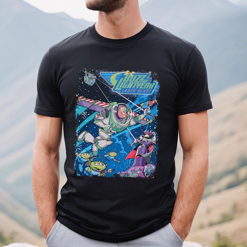 May include: Black t-shirt with a graphic print of Buzz Lightyear from Toy Story. The graphic features Buzz flying in space with a laser blast, along with other characters from the movie.