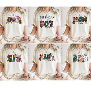 May include: Six white t-shirts with different colourful designs featuring the words "DAD", "BIRTHDAY BOY", "MOM", "SIS", "NANA", and "BRO".