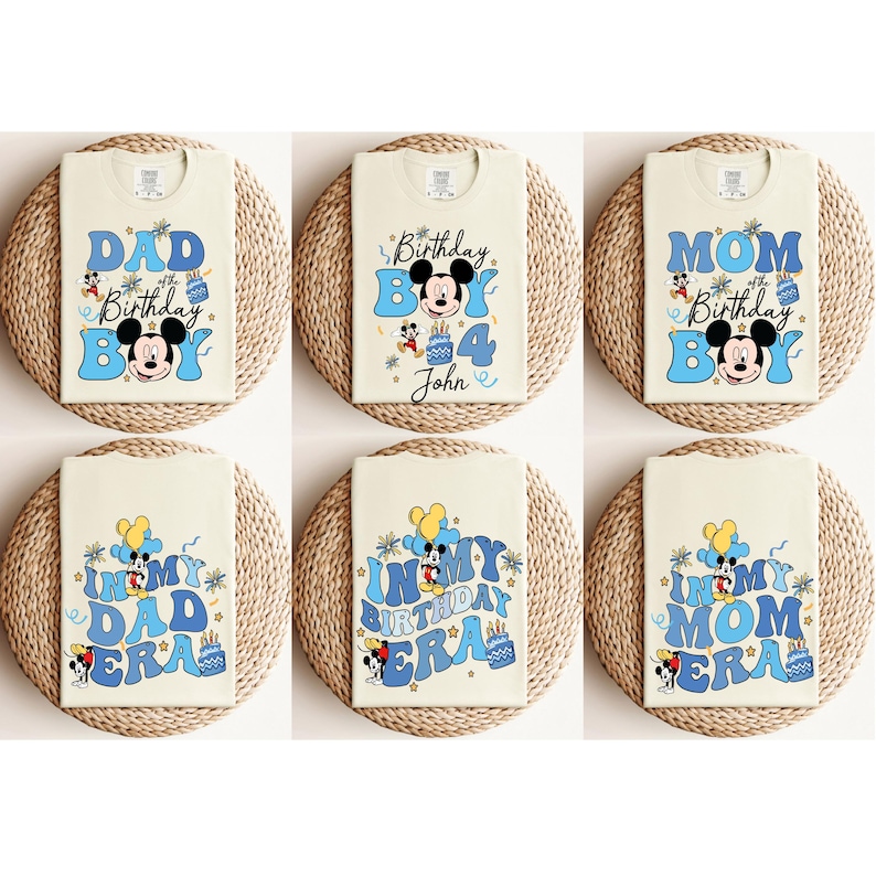 May include: Six white t-shirts with blue and yellow Mickey Mouse birthday designs. The shirts feature the text "Dad", "Mom", "In My Birthday Era", and "4th Birthday Boy John".