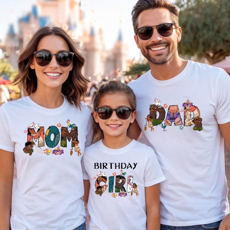 May include: A family of three wearing white t-shirts with a Moana theme. The shirts feature the words "Mom", "Dad", and "Birthday Girl" with Moana characters and elements from the film.