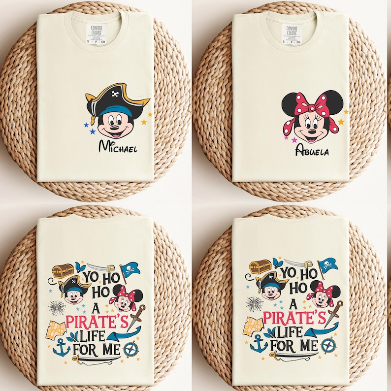 May include: Four white t-shirts with different designs featuring Mickey Mouse and Minnie Mouse. The shirts have the text "Yo ho ho a pirate's life for me" and the names "Michael" and "Abuela".