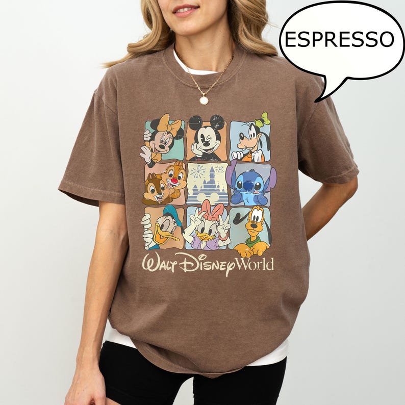 May include: Espresso-colored t-shirt featuring a grid of Disney characters including Mickey Mouse, Minnie Mouse, Donald Duck, and Stitch. The shirt has the text "Walt Disney World" in a vintage style.