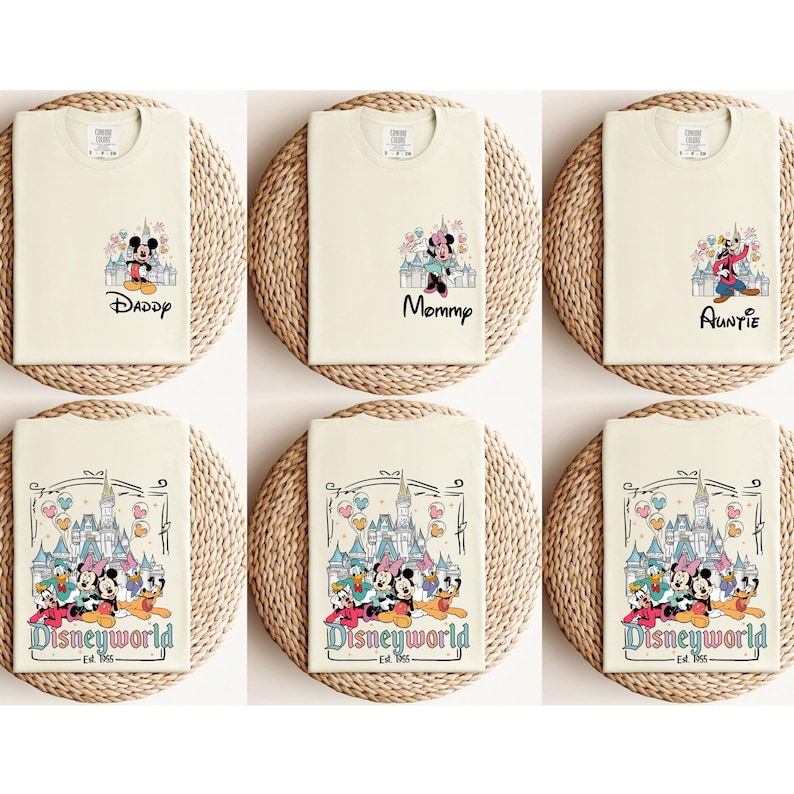 May include: Six cream-colored t-shirts with different Disney-themed designs. The shirts feature Mickey Mouse, Minnie Mouse, Goofy, Donald Duck, and Pluto. The shirts have the words "Daddy", "Mommy", "Auntie", and "Disneyworld Est. 1965" printed on them.