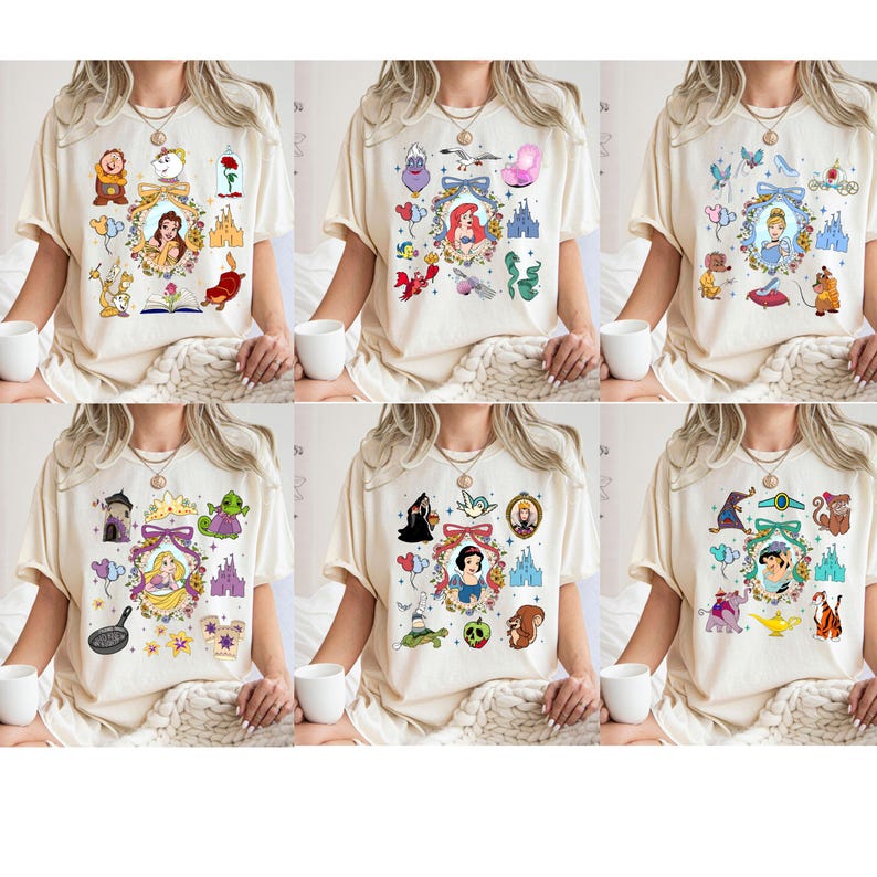 May include: Set of six white t-shirts with different Disney princess designs. Each shirt features a different princess with a variety of other characters and symbols from their respective movies. The designs include Cinderella, Snow White, Belle, Ariel, Jasmine, and Rapunzel.