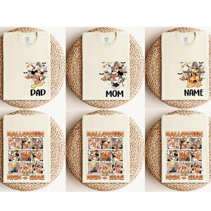 K&ouml;nnte beinhalten: Sechs cremefarbene T-Shirts mit Halloween-Motiven. Drei Shirts zeigen Mickey Mouse- und Ankergrafiken mit den W&ouml;rtern "DAD", "MOM" und "NAME". Die anderen drei Shirts haben eine Halloween-Grafik mit den Worten "HALLOWEEN 25 HIGH SEAS".