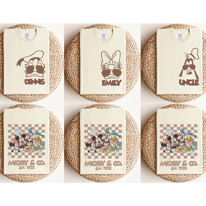 May include: Six cream-colored t-shirts with brown graphics. Three shirts feature cartoon characters with sunglasses and names: "DENNIS", "EMILY", and "UNCLE". The other three shirts have a checkered design with "MICKEY & CO. Est. 1928" and cartoon characters.