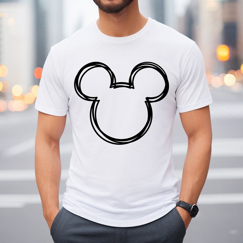 May include: White t-shirt with a black outline of Mickey Mouse's head.