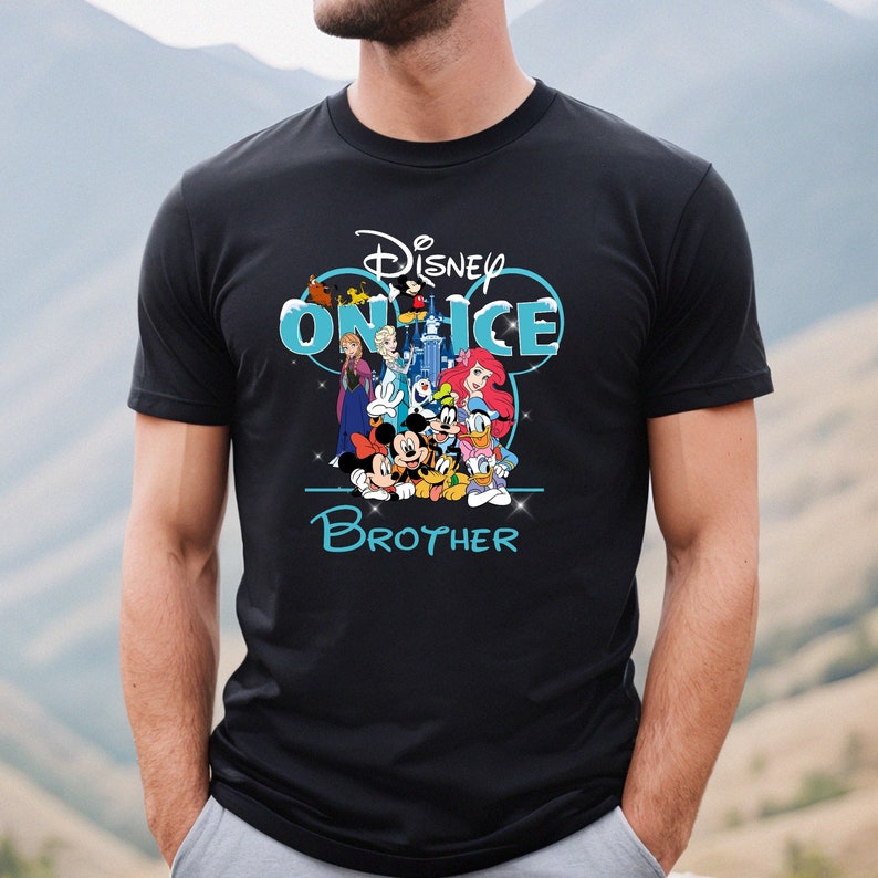 May include: Black t-shirt with a blue and white Disney on Ice graphic featuring Mickey Mouse, Minnie Mouse, Donald Duck, Goofy, and other Disney characters. The text "Brother" is below the graphic.