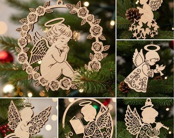 May include: A collection of wooden Christmas ornaments featuring angel designs. The ornaments include a praying angel within a floral wreath, angels with wings, and angels playing instruments. The ornaments are hanging on a Christmas tree.