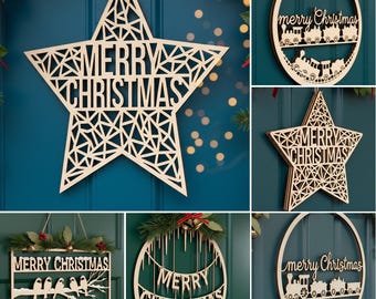 May include: A collection of wooden Christmas decorations. Includes a star-shaped sign with "MERRY CHRISTMAS" cut out, a wreath with a train, and a rectangular sign with birds. All are made of light-colored wood.