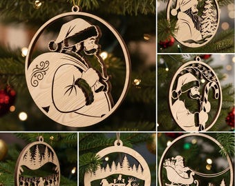 May include: A collection of wooden Christmas ornaments. Each ornament is circular with a cutout design featuring Santa Claus, a forest scene, or a sleigh. The ornaments are made of light-colored wood and are hanging on a Christmas tree.