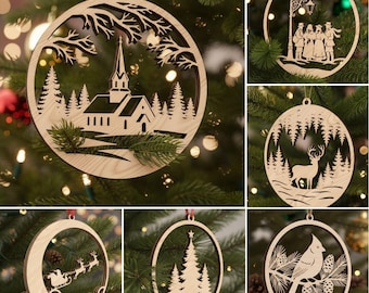 May include: A collection of wooden Christmas ornaments. Each ornament features a unique cutout design, including a church, a deer in a forest, a group of carolers, Santa's sleigh, a Christmas tree, and a bird on a branch. The ornaments are hanging on a Christmas tree.