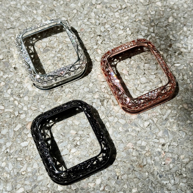 May include: Three decorative watch cases in silver, rose gold, and black with a diamond-like pattern. The cases are designed to fit a square-shaped watch face.