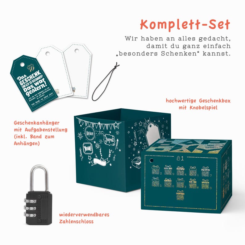 May include: A teal blue gift box set with a combination lock, gift tags, and a small calendar with a puzzle game. The box has a chalkboard design with white drawings of stars, fireworks, and the words "Yeah!" and "Bravo!" The text on the box reads "Komplett-Set" and "Wir haben an alles gedacht, damit du ganz einfach "besonders Schenken" kannst."