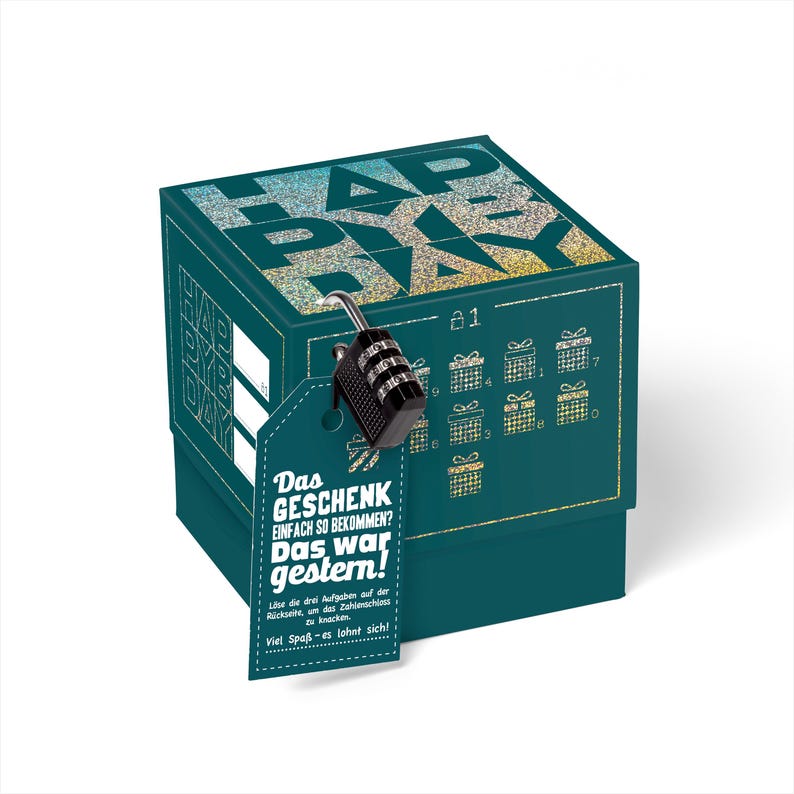 May include: A teal blue box with a gold glitter design and the words "Happy Birthday" on the top. The box has a combination lock on the front and a tag that says "Das Geschenk einfach so bekommen? Das war gestern!"  L&ouml;se die drei Aufgaben auf der R&uuml;ckseite, um das Zahlenschloss zu knacken. Viel Spa&szlig; - es lohnt sich!"