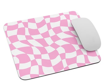 May include: Pink and white checkered mouse pad with a wavy pattern. The mouse pad is made of a soft, non-slip material and is perfect for use with a computer mouse.