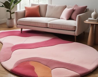 May include: A pink, orange, and red abstract area rug with a wavy design. The rug is in a living room with a white sofa and pillows.