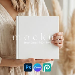 May include: A white square book mockup held by a person. The word "mockup" is printed on the book in a delicate font. Below the text are the words "Smart Object PSD + PNG". The Adobe Photoshop, Canva, and PicMonkey logos are at the bottom.