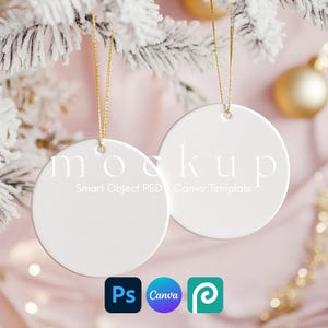 May include: Two round white ceramic ornaments with gold hanging strings. The ornaments feature the text "mockup" in a large serif font and "Smart Object PSD Canva Template" in a smaller sans-serif font printed across the center surface.