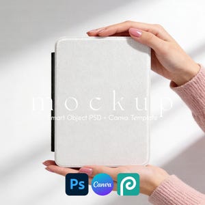 May include: A white rectangular case with a black spine is held between two hands. The word "mockup" is printed in white, along with "Smart Object PSD + Canva Template". Icons for Photoshop, Canva, and Placeit are visible.