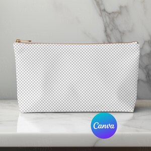 May include: A white canvas zippered pouch with a brown zipper pull. The pouch is sitting on a white marble surface.