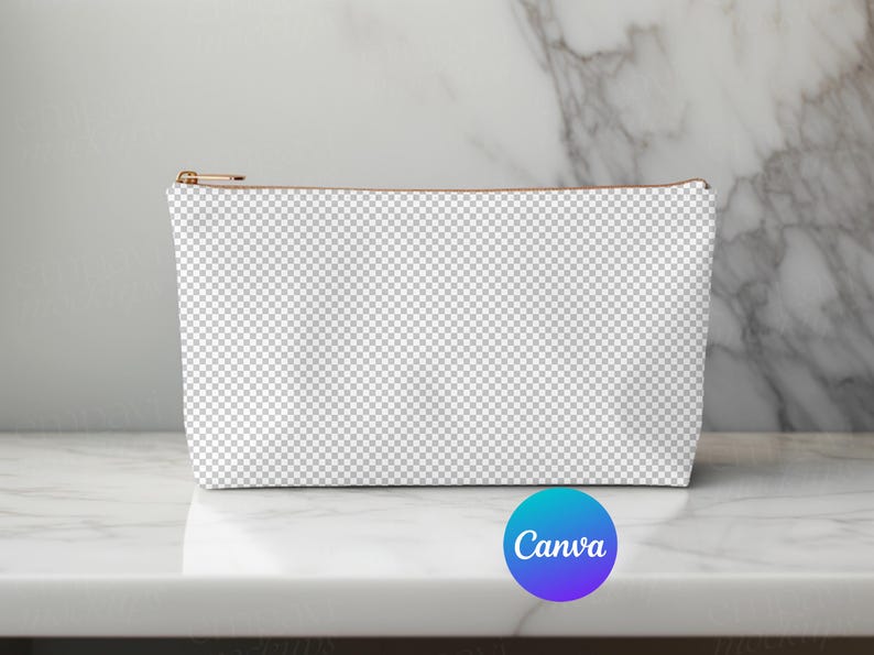 May include: A white canvas zippered pouch with a brown zipper pull. The pouch is sitting on a white marble surface.