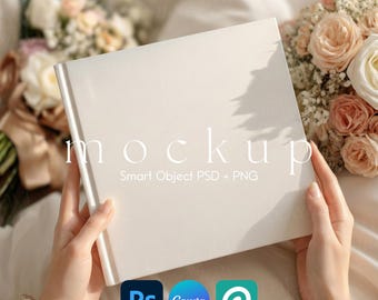 May include: A white book with the word "mockup" printed on the cover, held by a person. The book is surrounded by flowers and the logos for Photoshop, Canva, and Placeit are visible.