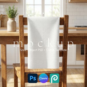 May include: A white waffle-weave kitchen towel hangs on a wooden chair in a kitchen setting. The towel is centered and the chair is made of dark wood. The word "mockup" is printed on the towel. The image also includes the logos for Photoshop, Canva, and Pixlr.