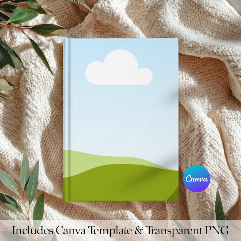 May include: A notebook with a sky-blue cover featuring a white cloud and green rolling hills. The notebook is set against a cream-colored knitted blanket. The text "Includes Canva Template & Transparent PNG" is at the bottom.