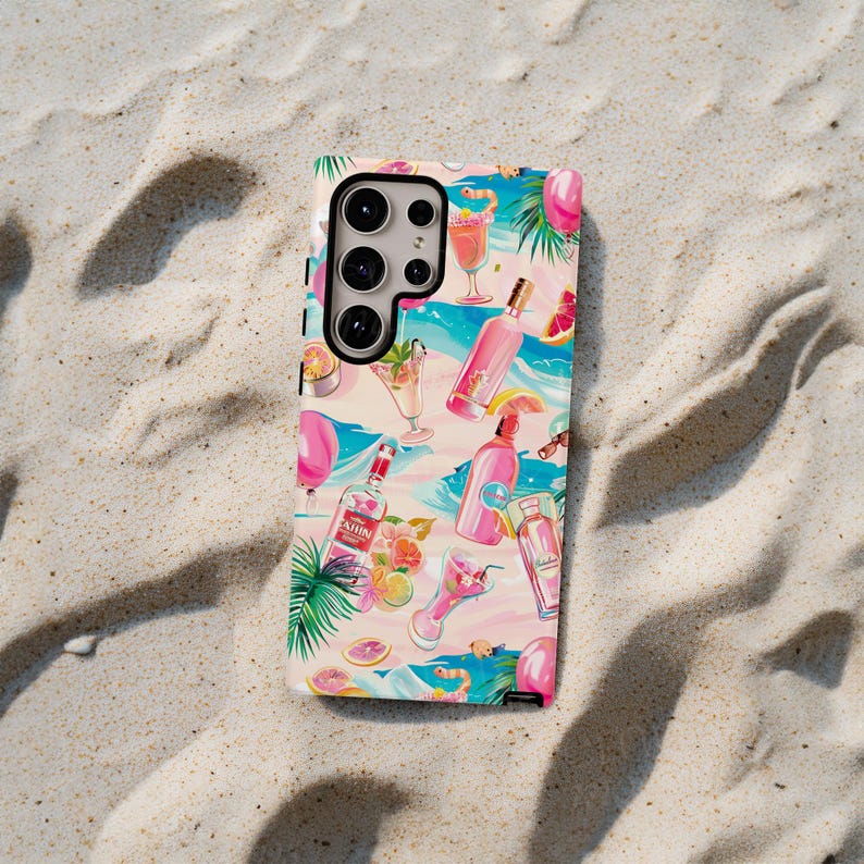 May include: A white phone case with a colorful pattern of cocktails, fruit, and palm leaves. The case has a camera cutout with a black ring around it.