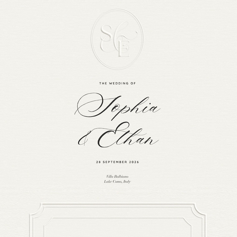 May include: Cream-colored wedding invitation with embossed initials in a circle at the top. The names "Sophia & Ethan" are written in elegant script, along with the wedding date and location: Villa Balbiano, Lake Como, Italy.