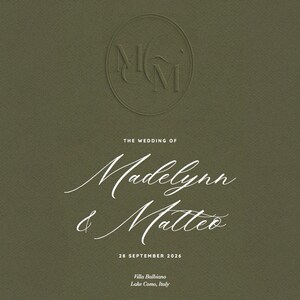 May include: Olive green wedding invitation with embossed initials in a circle at the top. The text reads "The Wedding of Madelynn & Matteo" with the date "28 September 2026" and location "Villa Balbiano, Lake Como, Italy."