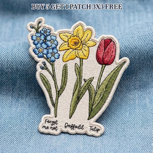May include: Embroidered patch featuring a floral design with a forget-me-not, daffodil, and tulip. The patch has a white background with green stems and leaves. The text "Forget me not", "Daffodil", and "Tulip" are included.