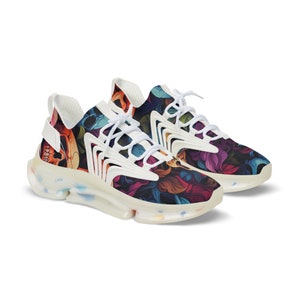 May include: White sneakers with a colorful floral and skull print. The sneakers have a thick, white sole with a translucent bottom.