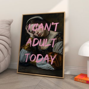 May include: A framed canvas print of a painting of a woman with a pink inscription that reads "I can't adult today".
