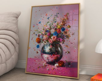 May include: A colorful bouquet of flowers in a silver disco ball vase on a pink background with confetti. The vase is surrounded by pink and white petals.
