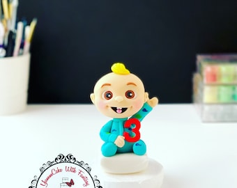 Baby and number handmade edible birthday cake topper decoration