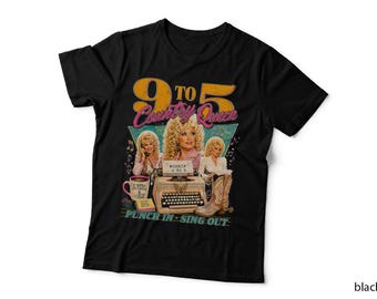 May include: A black t-shirt featuring a graphic print with the text 9 TO 5 COUNTRY QUEEN and PUNCH IN SING OUT. The design includes three images of a blonde woman, a typewriter, a coffee mug, and a cowboy boot in a vintage-inspired style.