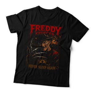May include: A black short-sleeved t-shirt featuring a graphic print of Freddy Krueger with a bladed glove. The text reads FREDDY KRUEGER in red at the top and NEVER SLEEP AGAIN in yellow at the bottom, set against a dark, fiery background.
